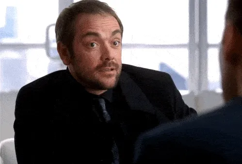 A gif from the show Supernatural. The demon Crowley takes out a scroll from
his suit and it unrolls into a ridiculously long
contract.